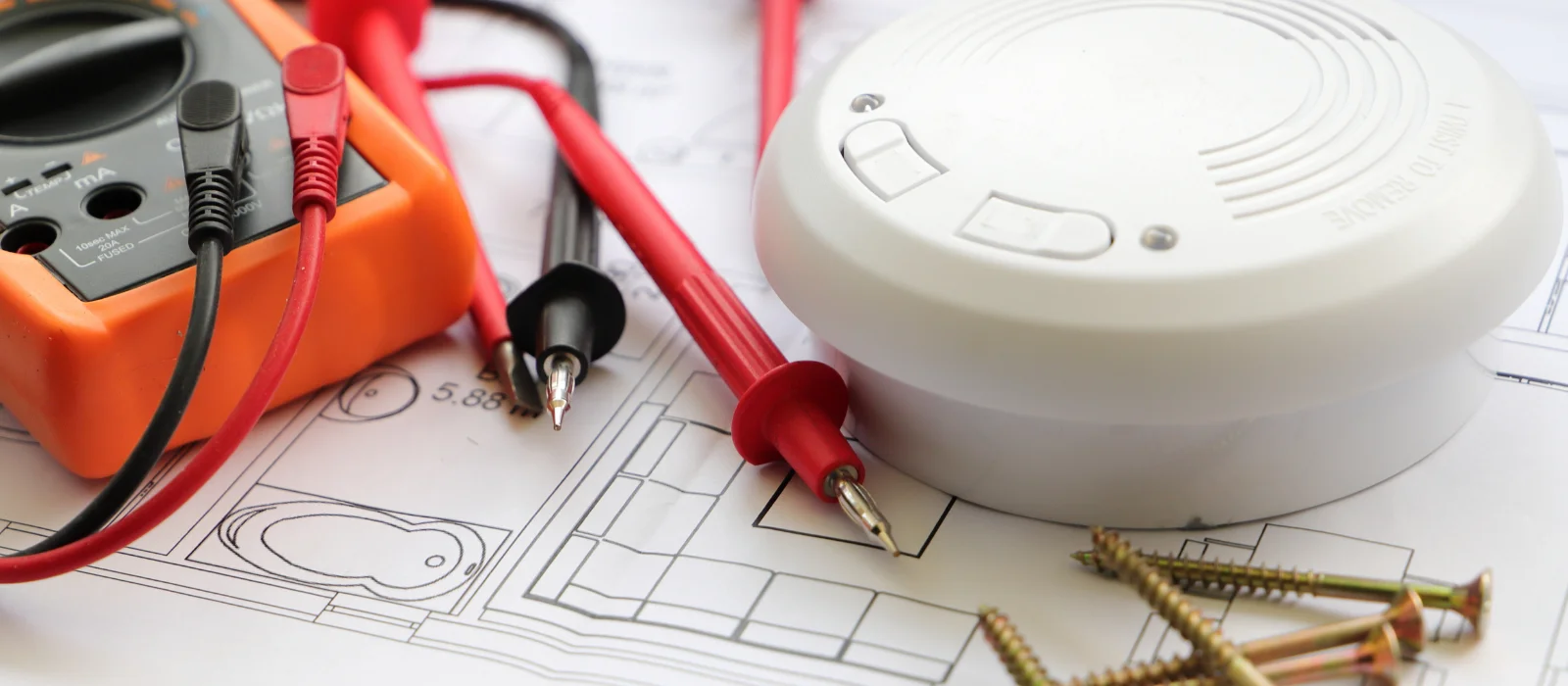 Technician installing a smoke alarm in a Melbourne home